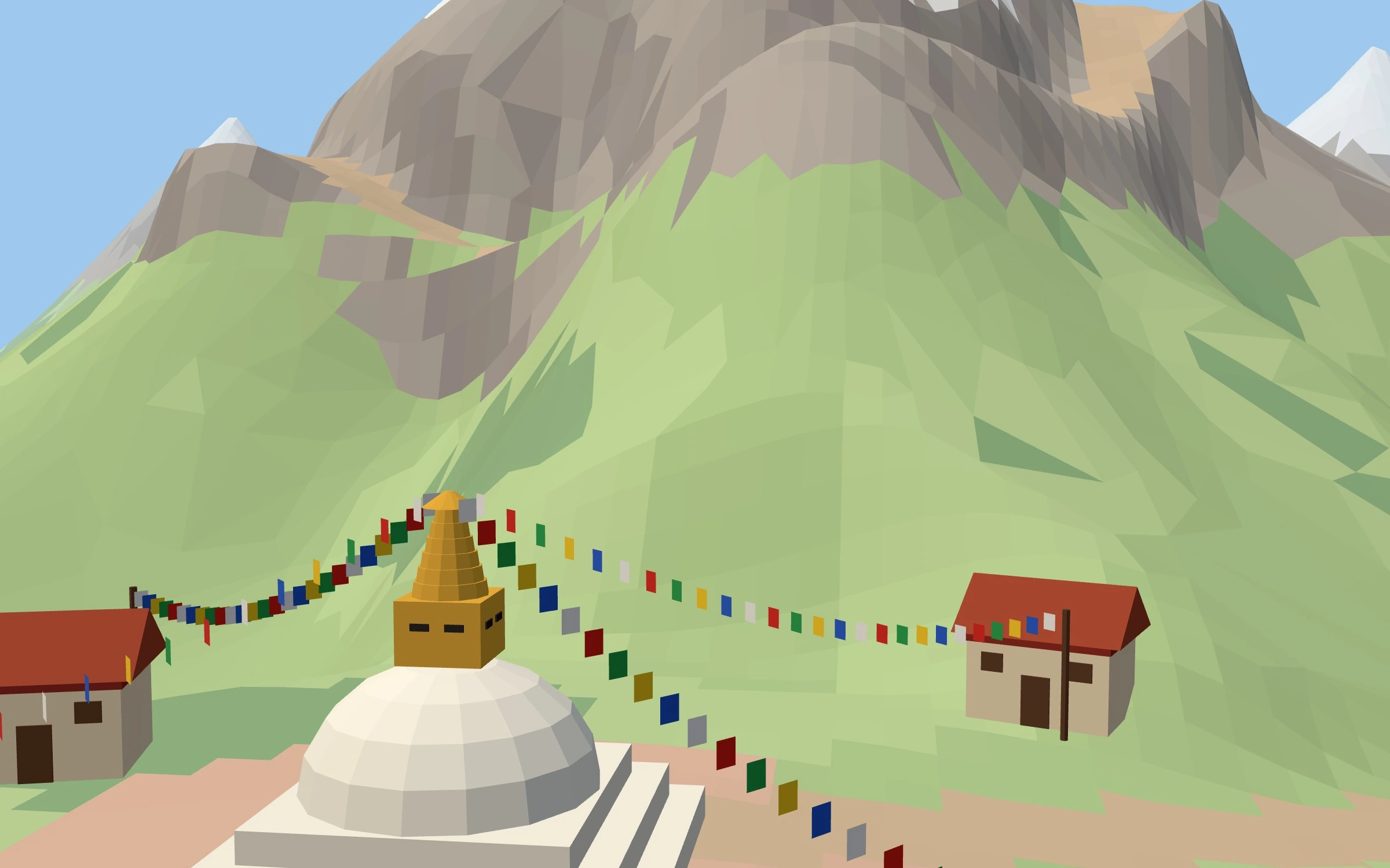 The village, the stupa and the prayer flags at the foot of the mountain.